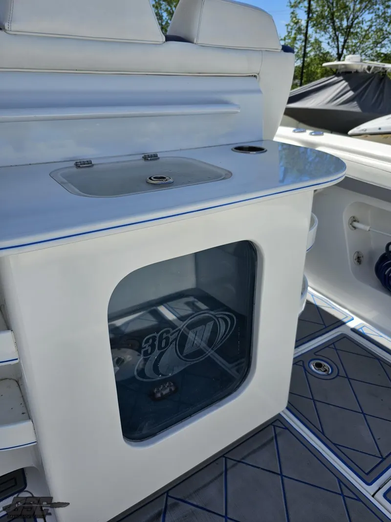 Slide: The Image of 2014 Deep Impact 36 Open boat interior with storage compartment and seating. - 25