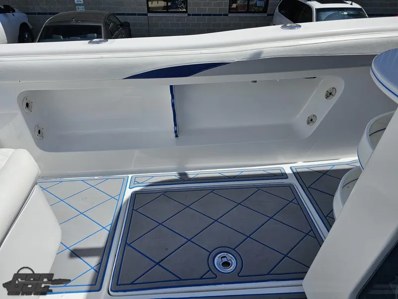 Slide: The Image of 2014 Deep Impact 36 Open boat interior with storage compartment and patterned flooring. - 26