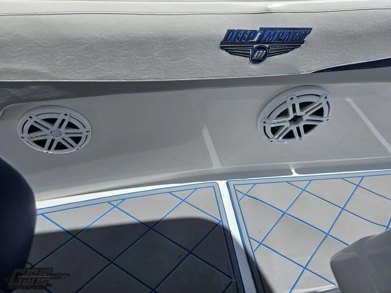 Slide: The Image of 2014 Deep Impact 36 Open boat interior with speakers and logo. - 28