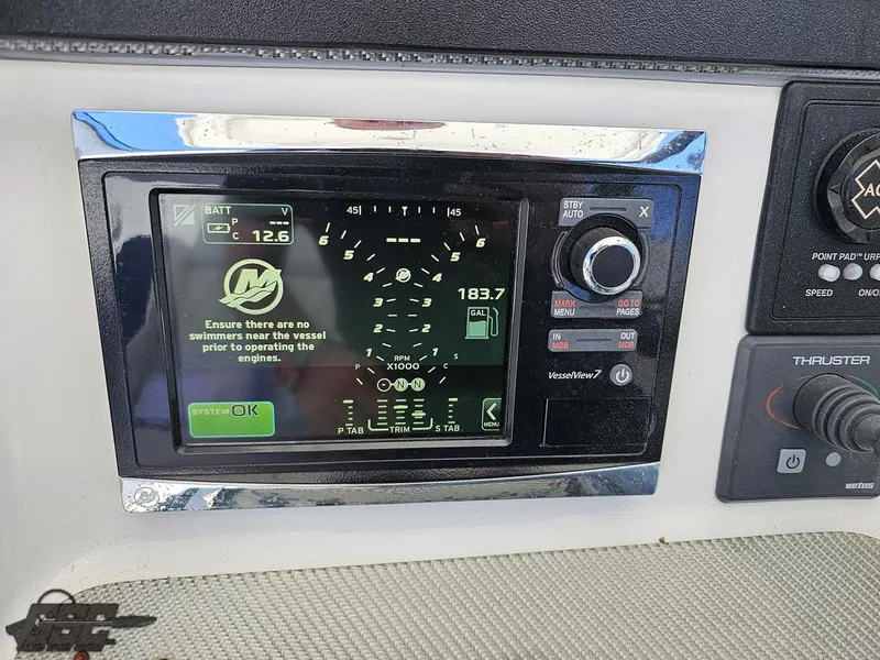 Slide: The Image of 2014 Deep Impact 36 Open boat control panel with digital display and navigation controls. - 37