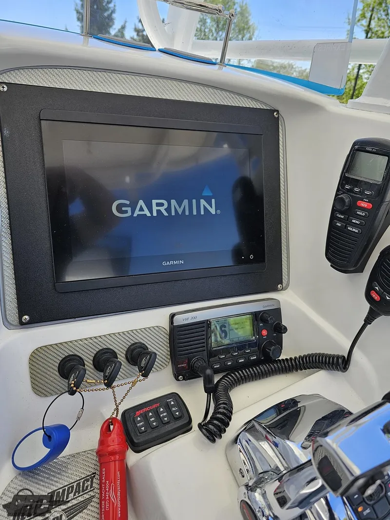 Slide: The Image of Garmin navigation system on a 2014 Deep Impact 36 Open boat dashboard. - 39