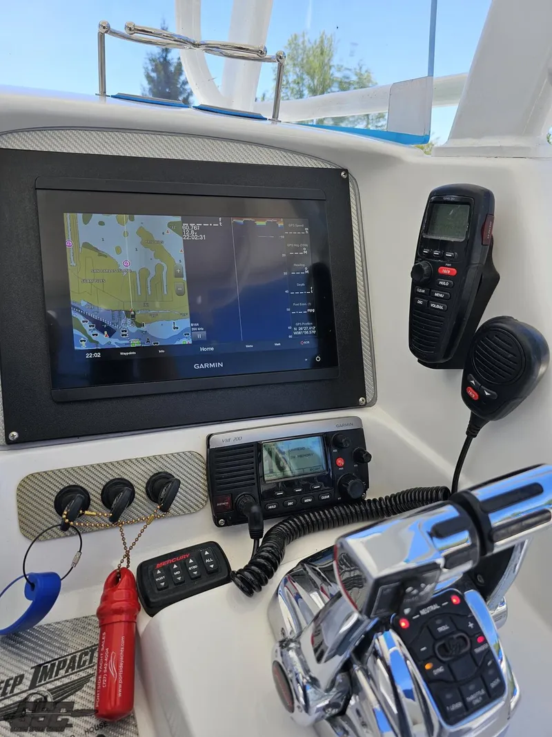 Slide: The Image of Control panel of a 2014 Deep Impact 36 Open boat with navigation and communication equipment. - 40