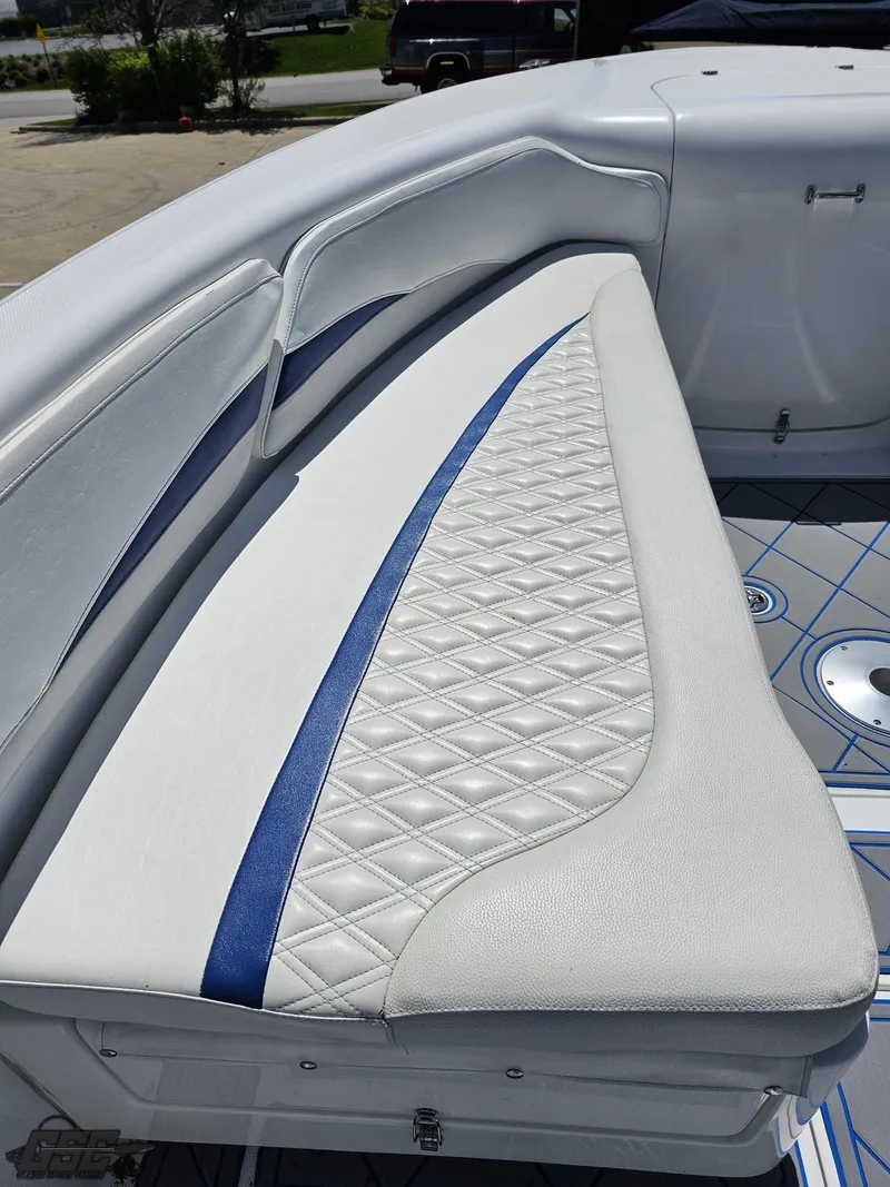 Slide: The Image of 2014 Deep Impact 36 Open boat with white and blue cushioned seating. - 47