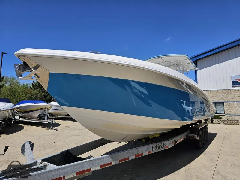 Slide: The Image of 2014 Deep Impact 36 Open boat on trailer under clear blue sky. - 8
