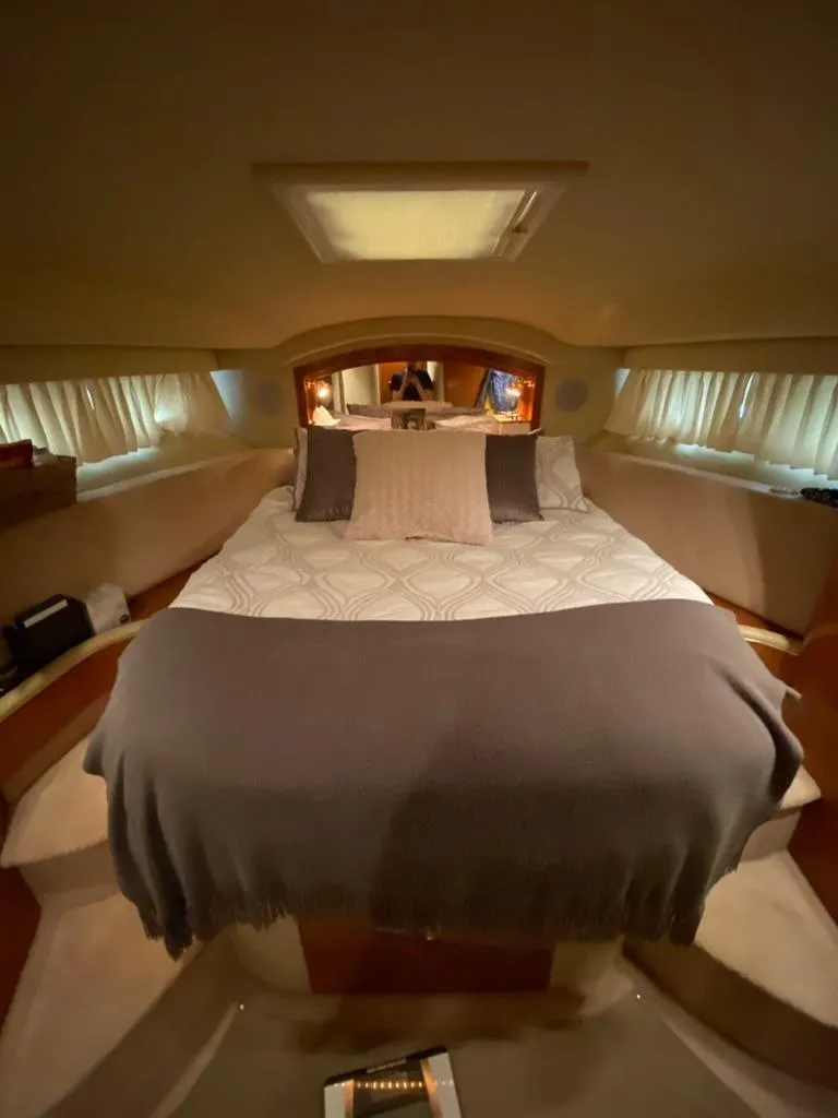 Slide: The Image of Luxurious bedroom interior of 2000 Sea Ray 400 Sedan Bridge yacht. - 15