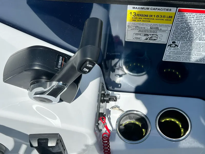 Slide: The Image of Close-up of 2024 Sylvan S3 CLZ DH Tritoon boat controls and capacity label. - 11