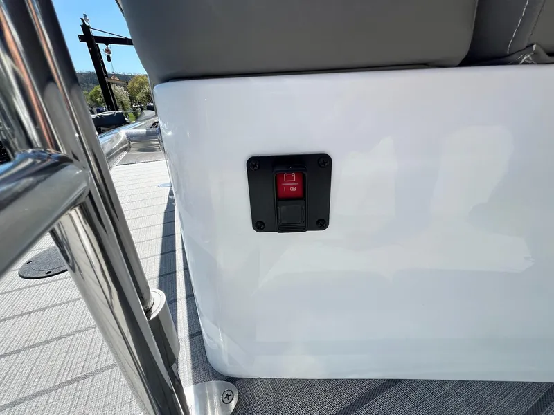 Slide: The Image of Close-up of control switch on 2024 Sylvan S3 CLZ DH Tritoon boat. - 14