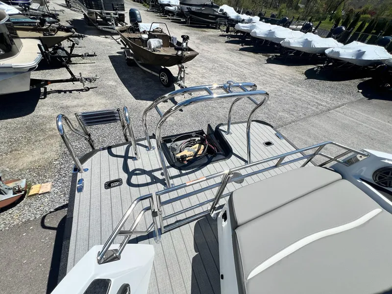Slide: The Image of 2024 Sylvan S3 CLZ DH Tritoon boat, rear deck view with ladder and seating. - 17