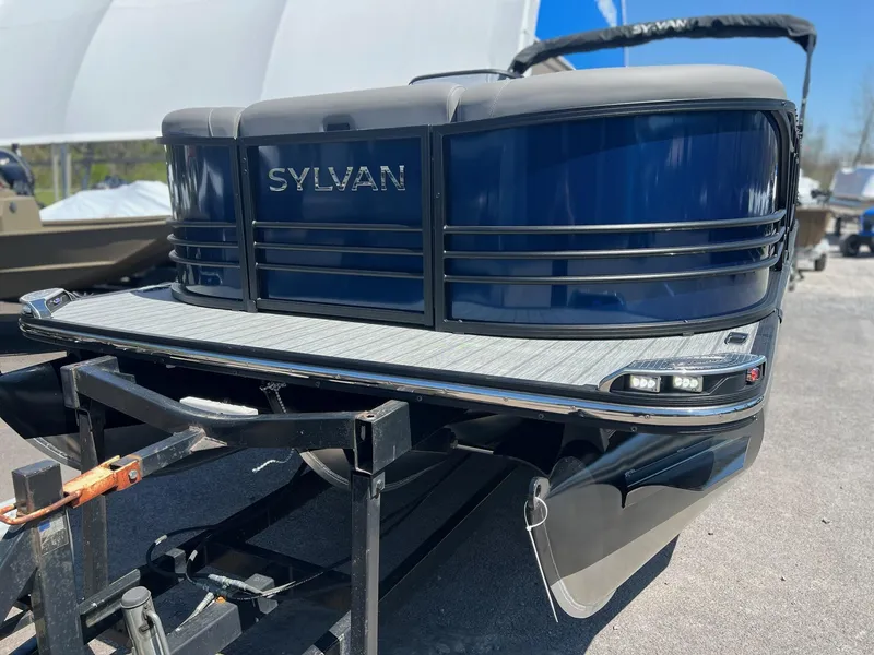 Slide: The Image of 2024 Sylvan S3 CLZ DH Tritoon boat on trailer, front view. - 26