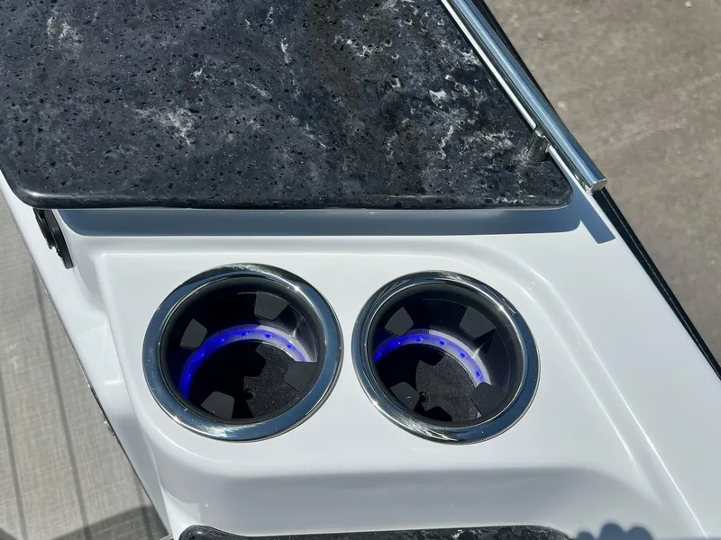 Slide: The Image of 2024 Sylvan S3 CLZ DH Tritoon boat with illuminated cup holders and sleek countertop. - 27