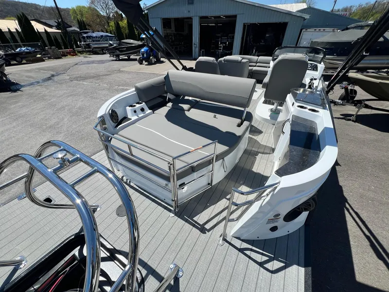 Slide: The Image of 2024 Sylvan S3 CLZ DH Tritoon boat with gray seating, stainless steel railings, and modern amenities. - 3