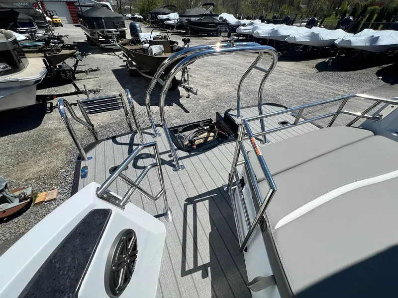 Slide: The Image of 2024 Sylvan S3 CLZ DH Tritoon boat with stainless steel railings and cushioned seating. - 39