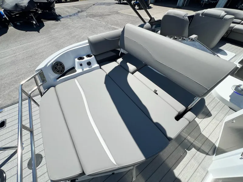 Slide: The Image of 2024 Sylvan S3 CLZ DH Tritoon boat with gray seating and cup holders. - 40