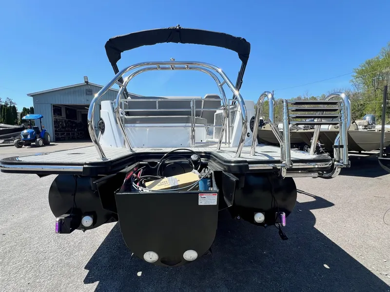 Slide: The Image of 2024 Sylvan S3 CLZ DH Tritoon boat rear view, in stock, with stainless steel ladder. - 43