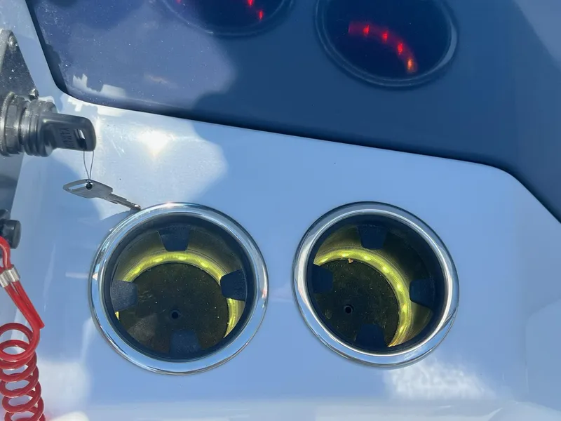 Slide: The Image of Close-up of 2024 Sylvan S3 CLZ DH Tritoon boat's ignition key and cup holders. - 44