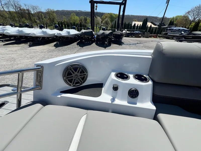 Slide: The Image of 2024 Sylvan S3 CLZ DH Tritoon boat interior with speaker and cup holders. - 45