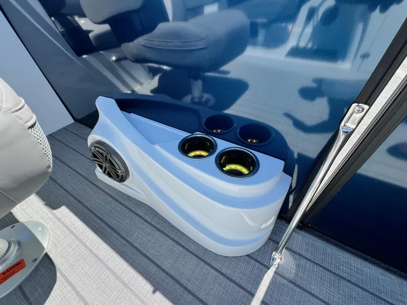 Slide: The Image of 2024 Sylvan S3 CLZ DH Tritoon boat interior with cup holders and speaker. - 47
