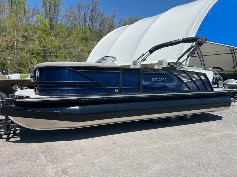 Slide: The Image of 2024 Sylvan S3 CLZ DH Tritoon boat in stock, displayed outdoors. - 48