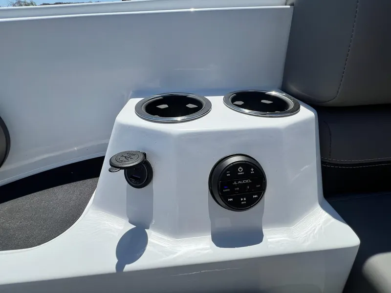 Slide: The Image of 2024 Sylvan S3 CLZ DH Tritoon console with cup holders and audio controls. - 49