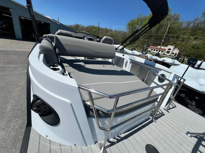 Slide: The Image of 2024 Sylvan S3 CLZ DH Tritoon boat with gray seating and stainless steel railings. - 7