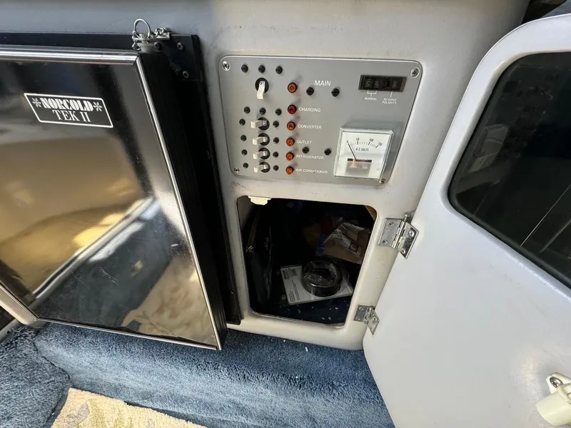 Slide: The Image of Control panel and storage compartment in 1987 Sea Ray Pachanga 32 boat. - 16