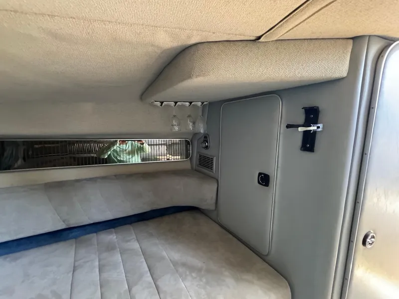 Slide: The Image of Interior cabin of 1987 Sea Ray Pachanga 32 boat with beige upholstery. - 18