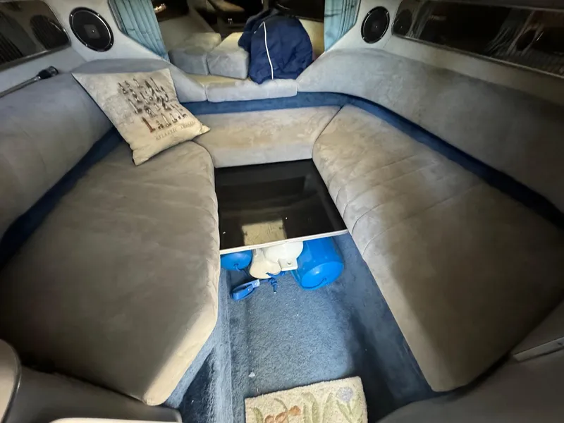 Slide: The Image of Interior cabin of 1987 Sea Ray Pachanga 32 with cushioned seating and storage. - 19