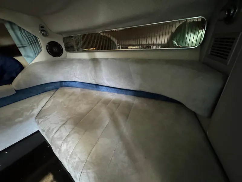 Slide: The Image of Interior cabin of a 1987 Sea Ray Pachanga 32 boat with cushioned seating. - 21