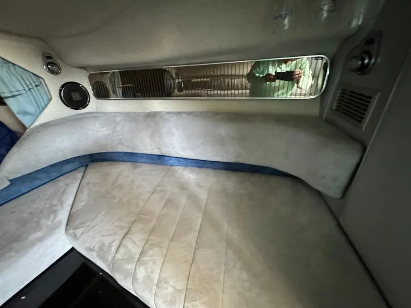 Slide: The Image of Interior cabin of a 1987 Sea Ray Pachanga 32 boat with cushioned seating. - 22