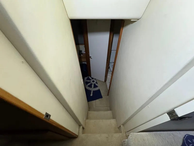 Slide: The Image of Narrow stairway inside 1987 Sea Ray Pachanga 32 boat. - 24