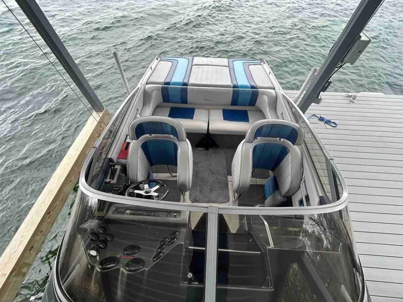 Slide: The Image of 1987 Sea Ray Pachanga 32 boat interior with blue and white seating. - 3