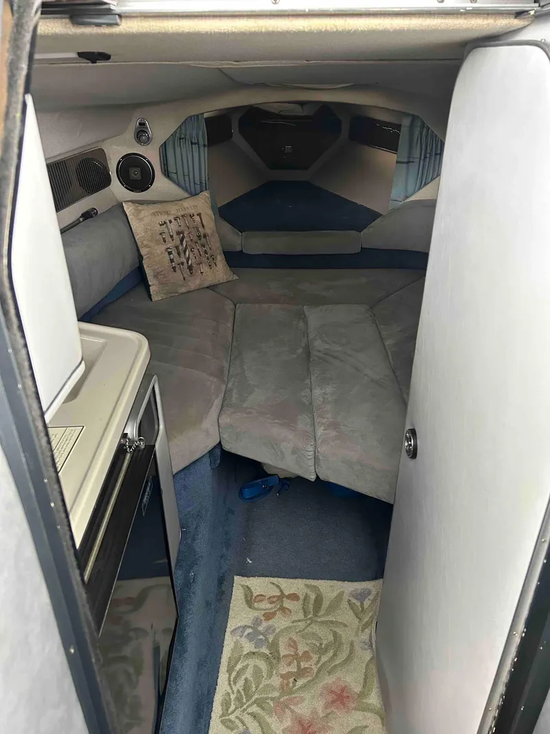 Slide: The Image of Interior cabin of 1987 Sea Ray Pachanga 32 boat with seating and kitchenette. - 6