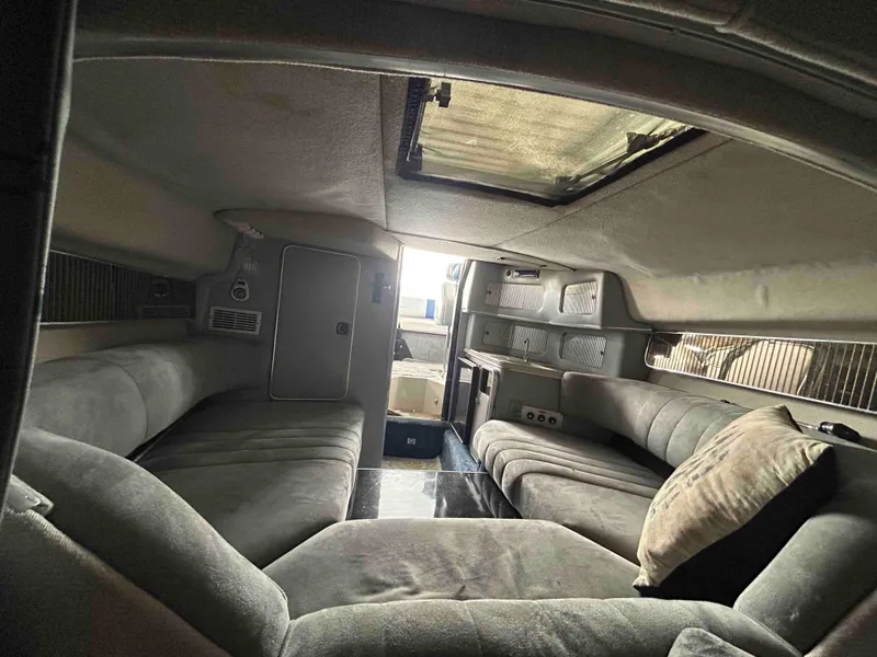 Slide: The Image of Interior cabin of 1987 Sea Ray Pachanga 32 boat with seating and skylight. - 9