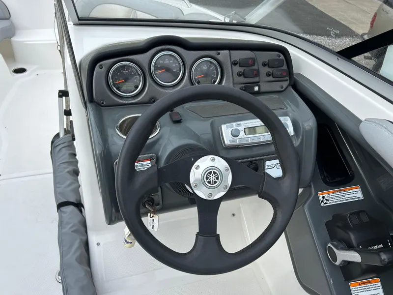 Slide: The Image of 2012 Yamaha Boats AR240 dashboard and steering wheel close-up. - 5