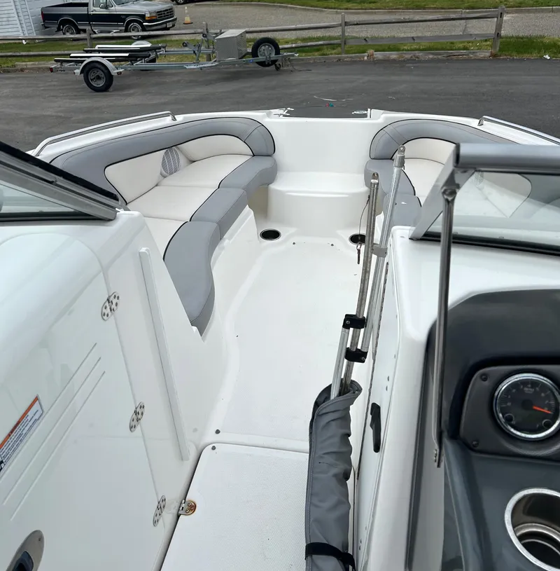 Slide: The Image of 2012 Yamaha Boats AR240 interior with gray seating and white deck. - 6