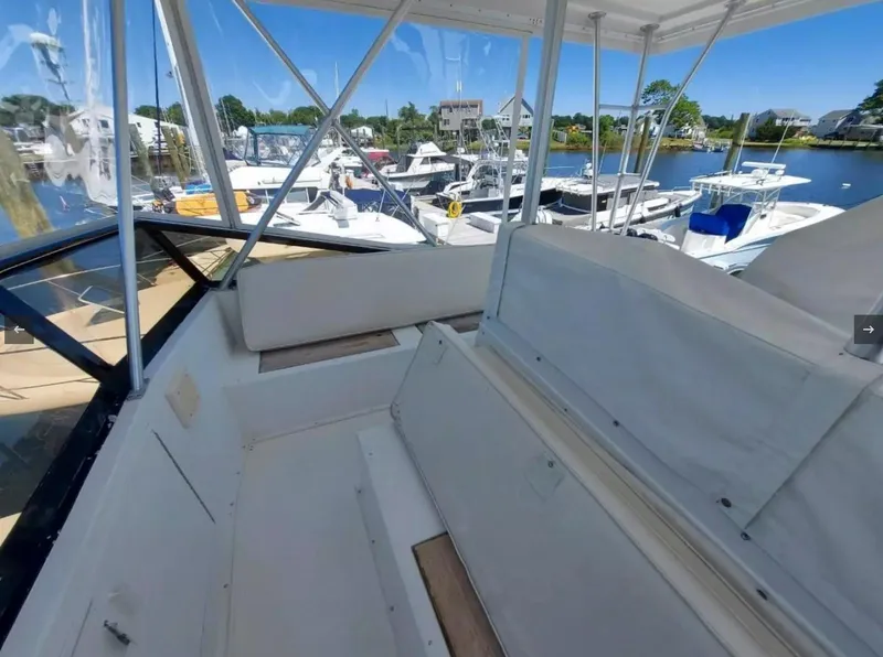 Slide: The Image of 1988 Viking 41 Convertible boat interior with marina view. - 5