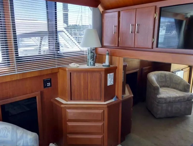 Slide: The Image of Interior of 1988 Viking 41 Convertible yacht with wooden cabinetry and seating. - 9
