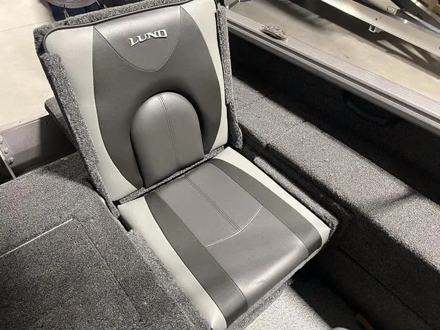 Slide: The Image of 2024 Lund 1775 Impact XS Sport boat seat in gray and black upholstery. - 12