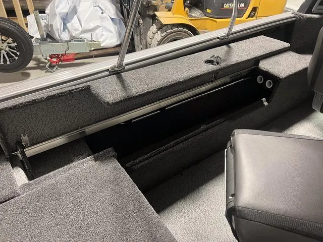 Slide: The Image of 2024 Lund 1775 Impact XS Sport boat interior storage compartment. - 17
