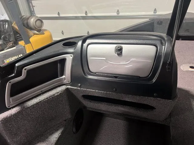 Slide: The Image of 2024 Lund 1775 Impact XS Sport boat interior storage compartments. - 21