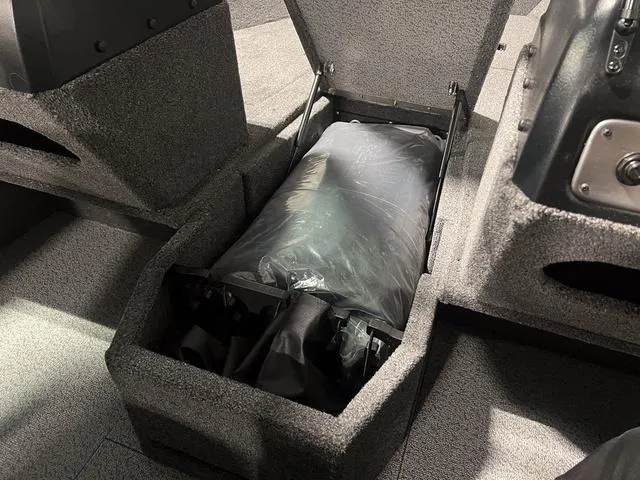 Slide: The Image of 2024 Lund 1775 Impact XS Sport storage compartment with equipment. - 26