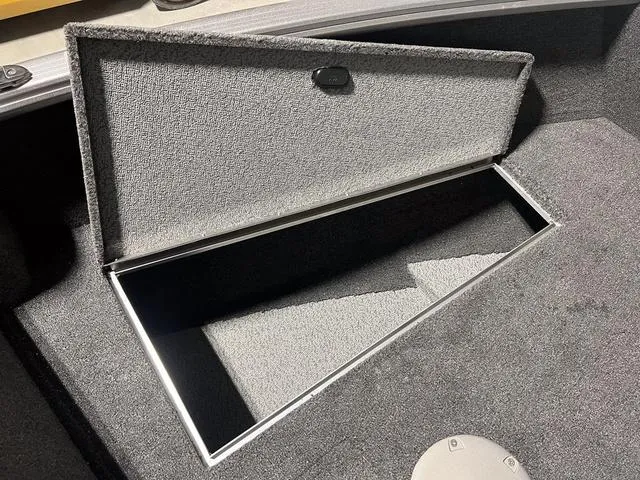 Slide: The Image of 2024 Lund 1775 Impact XS Sport boat storage compartment. - 28