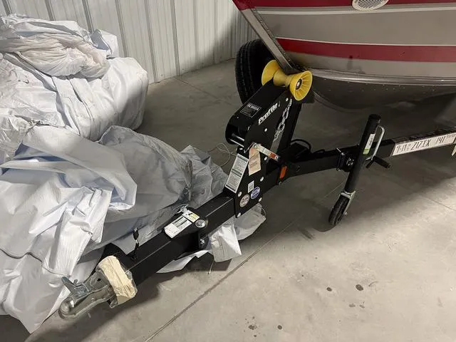 Slide: The Image of 2024 Lund 1775 Impact XS Sport boat on trailer in storage. - 3