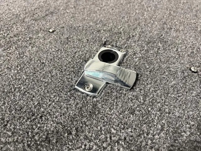 Slide: The Image of Close-up of 2024 Lund 1775 Impact XS Sport boat latch on carpeted surface. - 35