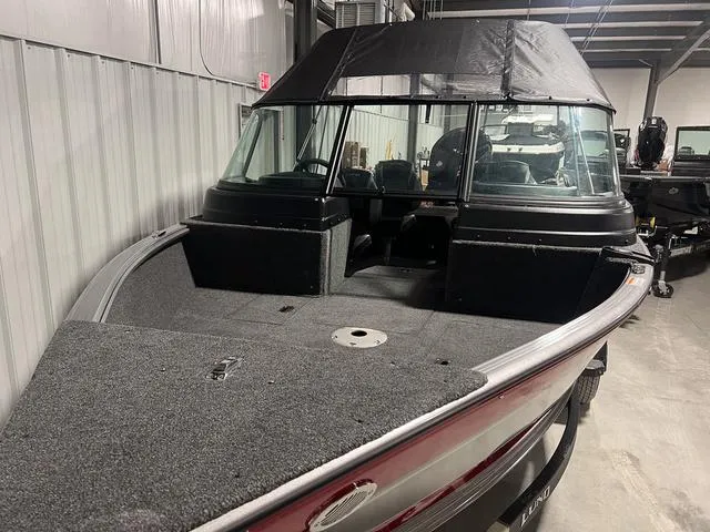 Slide: The Image of 2024 Lund 1775 Impact XS Sport fishing boat in a storage facility. - 4