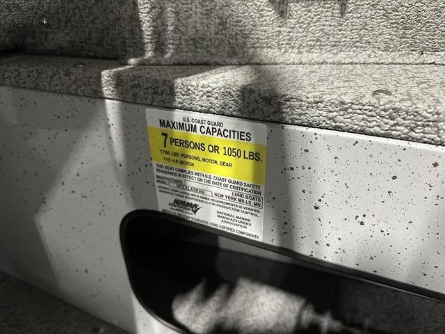 Slide: The Image of 2024 Lund 1875 Alaskan SS boat capacity label, 7 persons or 1050 lbs. - 16