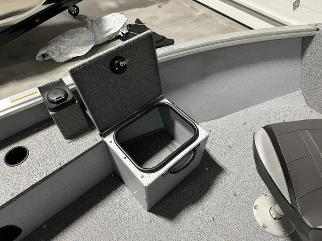 Slide: The Image of 2024 Lund 1875 Alaskan SS boat interior with open storage compartment. - 19