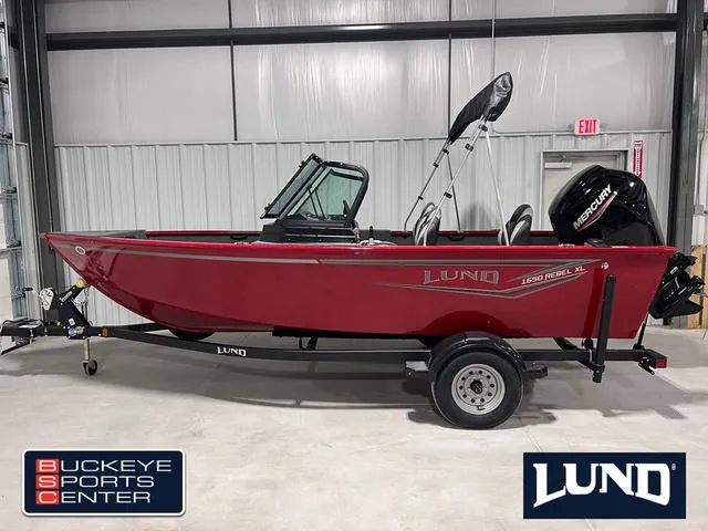 Slide: The Image of 2024 Lund 1650 Rebel XL Sport boat in red, displayed at Buckeye Sports Center. - 1