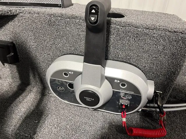 Slide: The Image of 2024 Lund 1650 Rebel XL Sport boat throttle control system. - 23