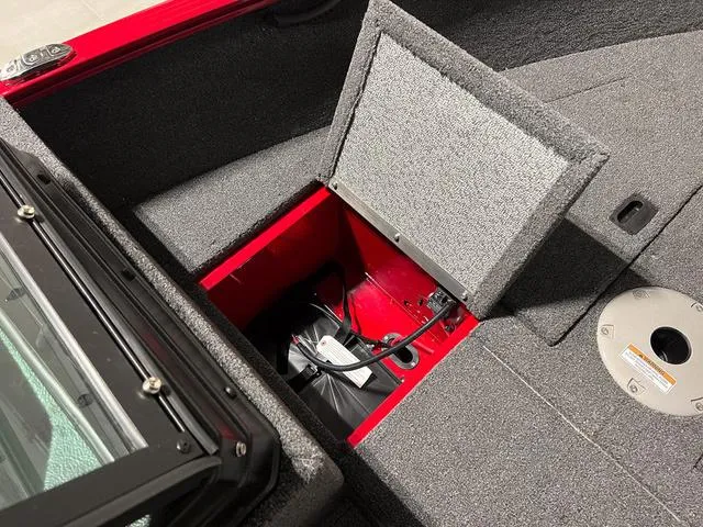 Slide: The Image of 2024 Lund 1650 Rebel XL Sport boat storage compartment. - 26